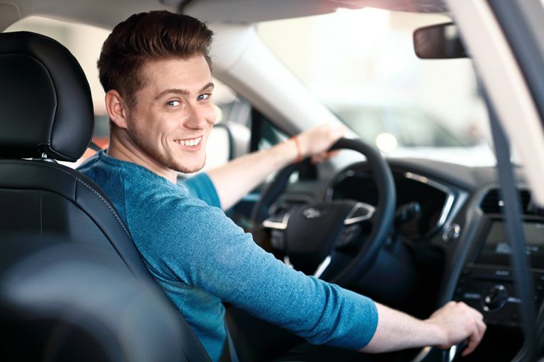 man driving a car